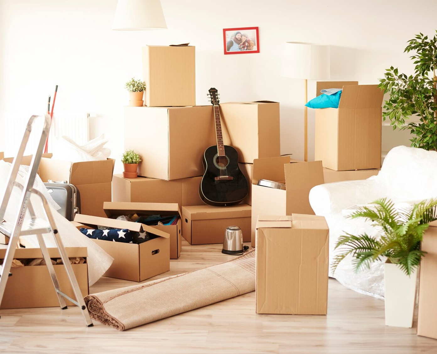 Movers carrying household boxes